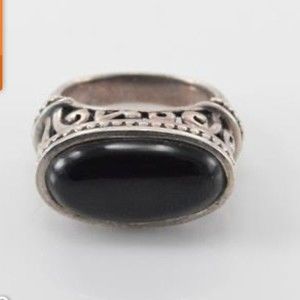 Black onyx oval cabochon ring size 7 set in Sterling silver  marked 925